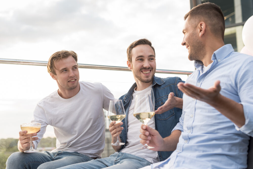 Group of friends chatting and smiling in relaxed indoor social setting